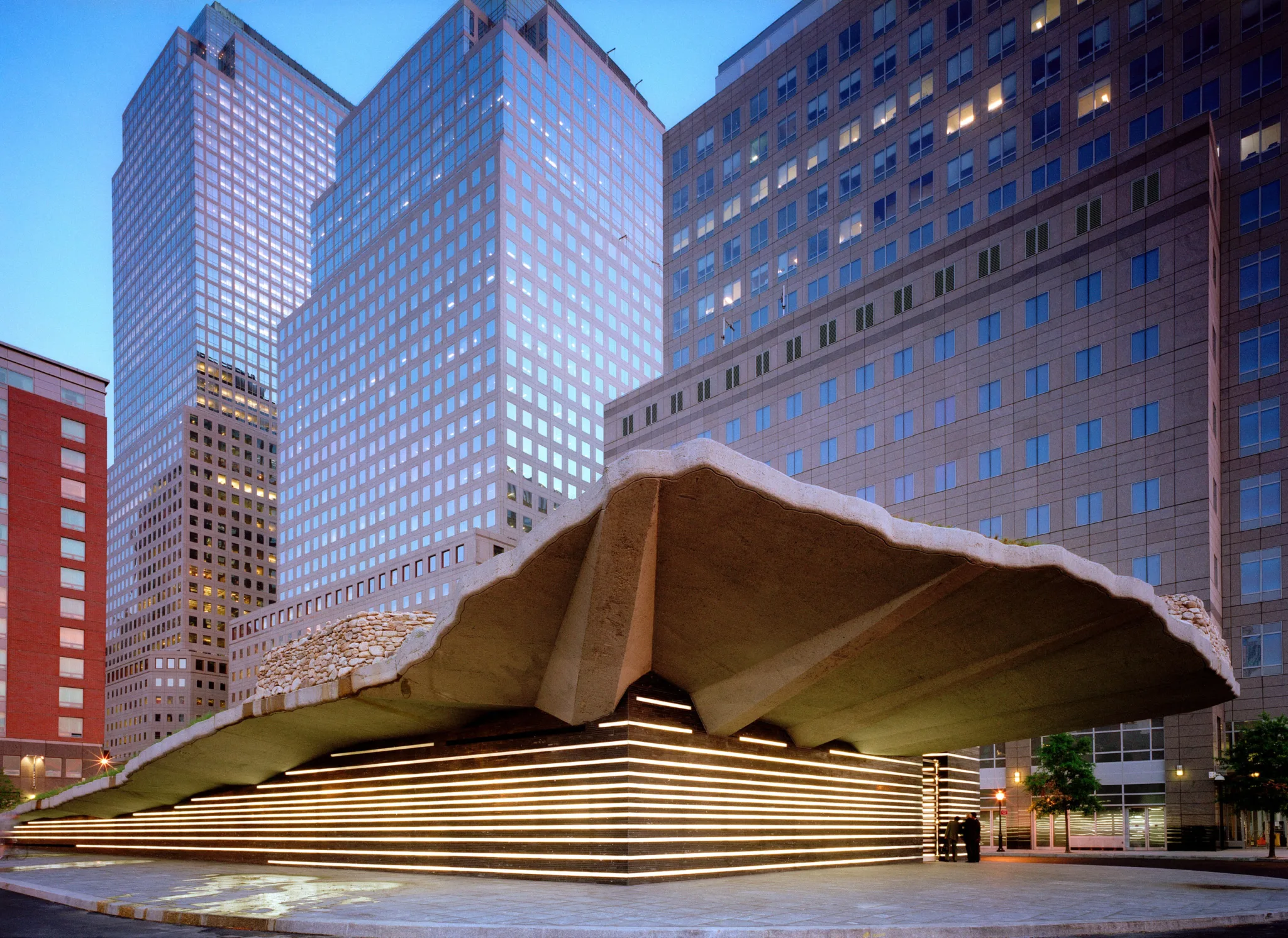 Irish Hunger Memorial, Battery Park City—sod-topped cantilever with illuminated horizontal bands against Lower Manhattan towers